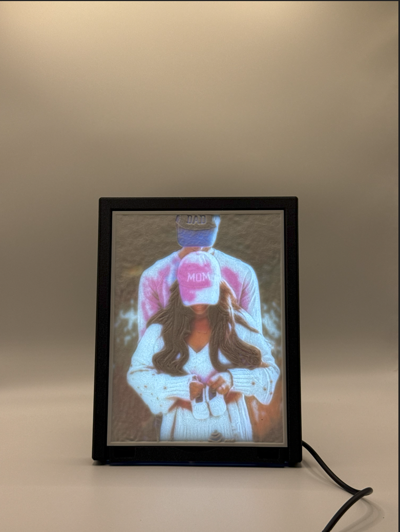 Lithophane photograph displayed in a lit frame