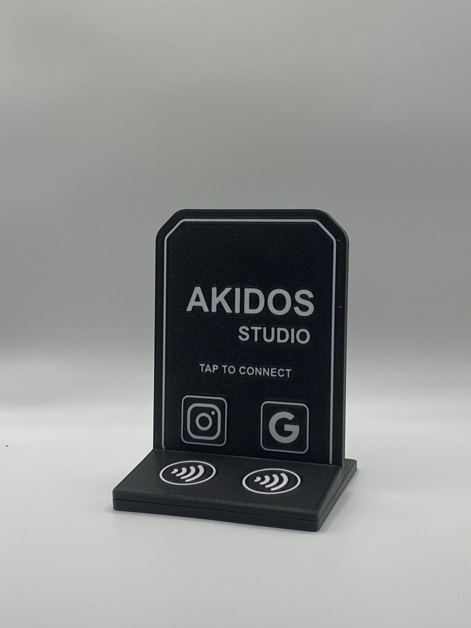 Printed Akidos Studio NFC stand viewed from the front