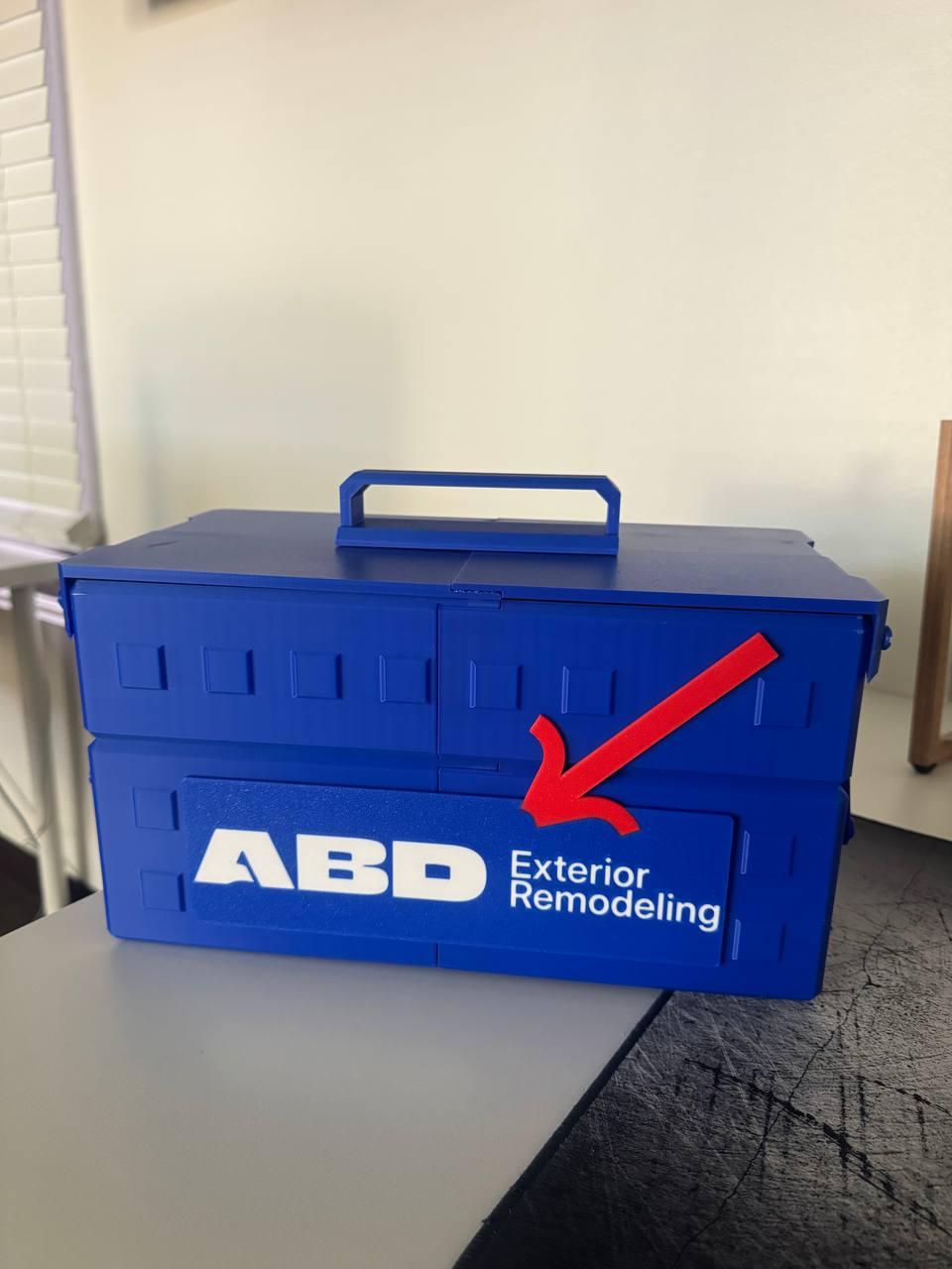 Original project photo of the blue exterior remodeling toolbox